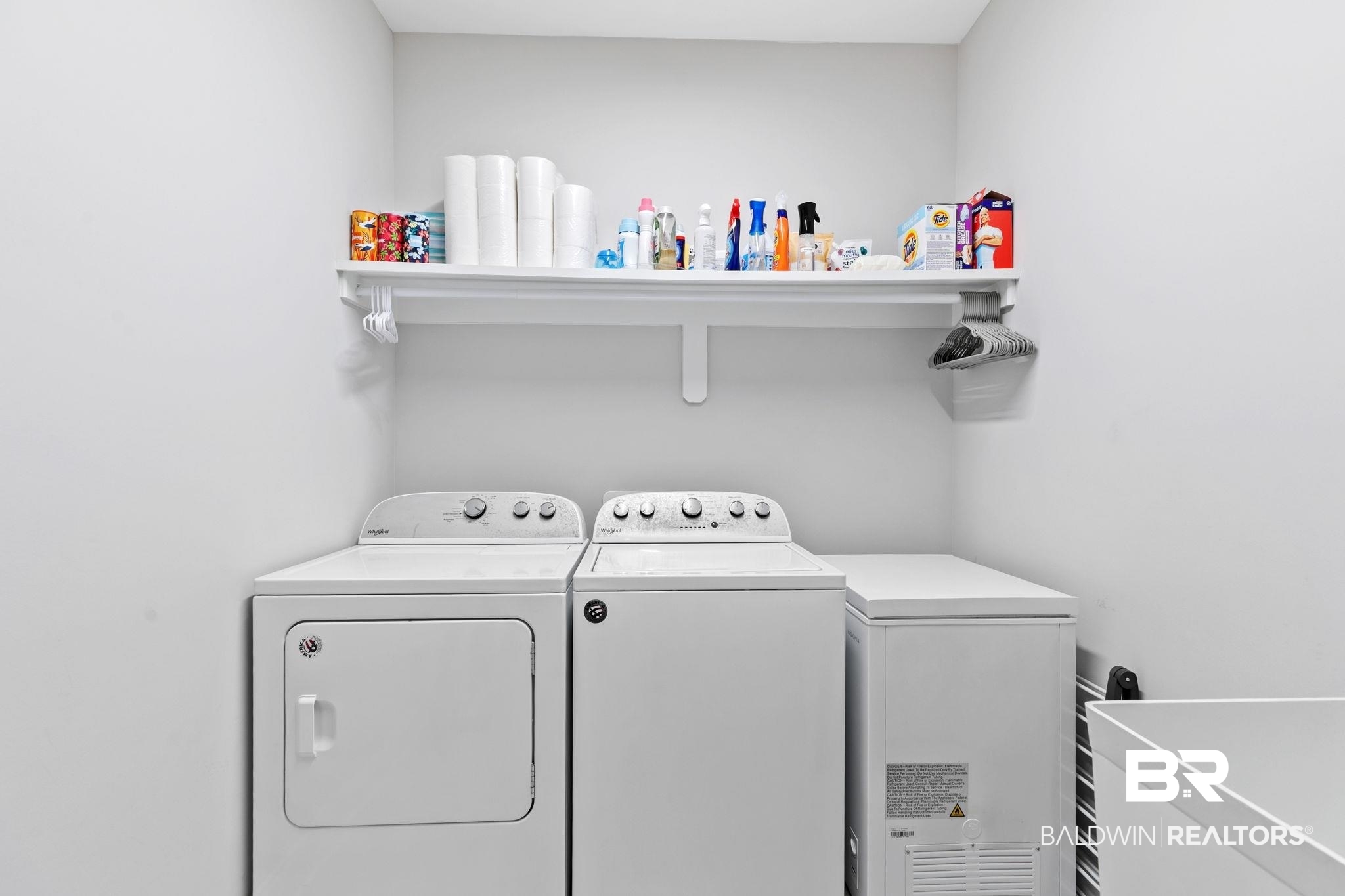 13233 Ibis Boulevard Daphne, AL 36527 - Photo 52 of 100 Dedicated laundry area featuring a built-in shelf, white walls, and a light-colored flooring