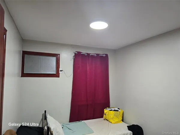 a view of a hallway with two chairs and a table
