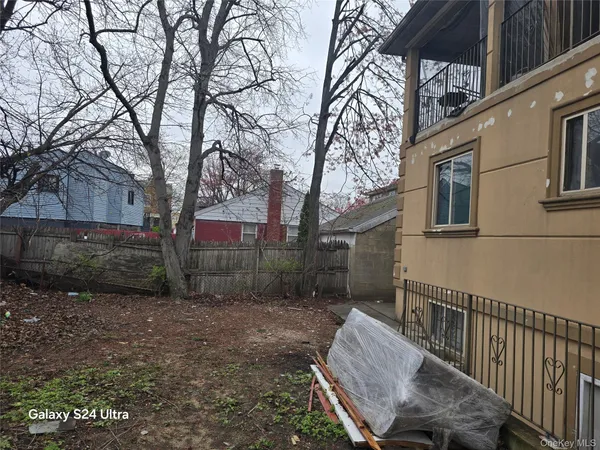 a view of a patio with a yard
