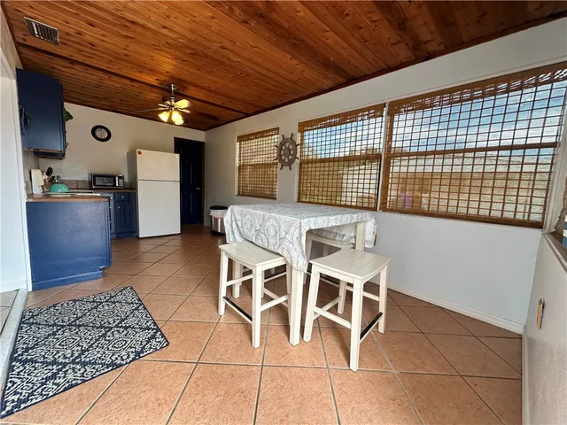 a dinning table and chairs in a room