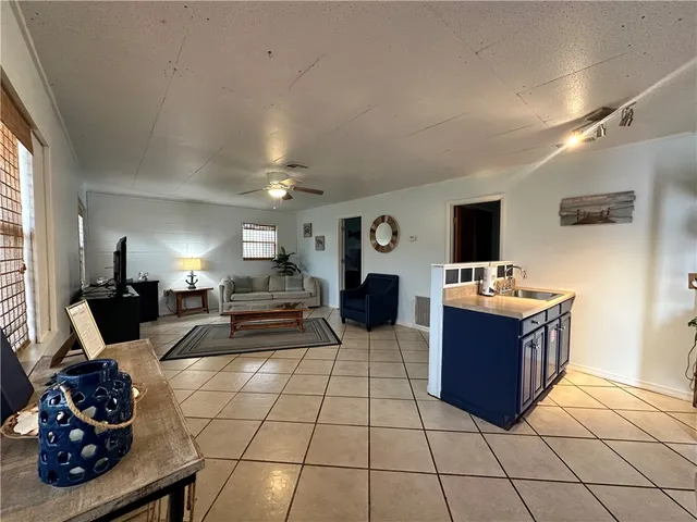 a room with furniture window and flat screen tv