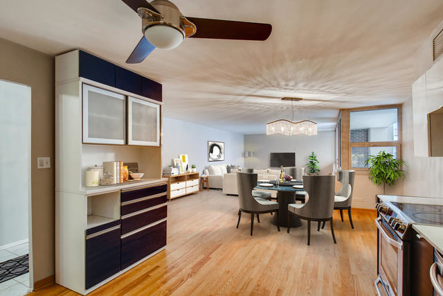6147 North Sheridan Road, Unit 16A Chicago, IL 60660 - Photo 12 of 30 a living room with furniture and wooden floor