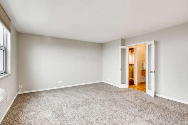 6147 North Sheridan Road, Unit 16A Chicago, IL 60660 - Photo 15 of 30 a view of an empty room and window