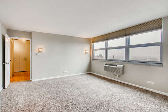 6147 North Sheridan Road, Unit 16A Chicago, IL 60660 - Photo 16 of 30 a view of an empty room with a window