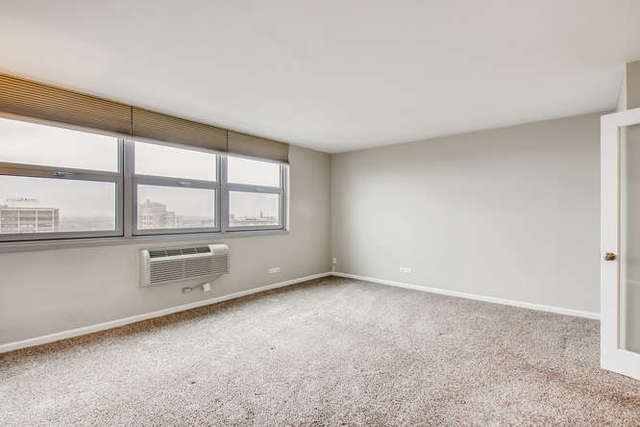 6147 North Sheridan Road, Unit 16A Chicago, IL 60660 - Photo 17 of 30 an empty room with windows