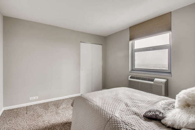 6147 North Sheridan Road, Unit 16A Chicago, IL 60660 - Photo 20 of 30 a bedroom with a bed and a window