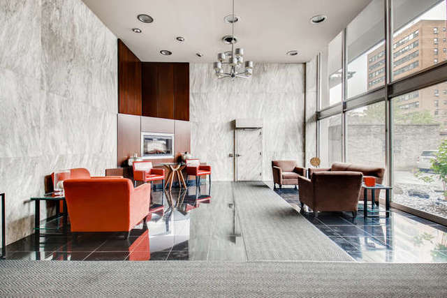 6147 North Sheridan Road, Unit 16A Chicago, IL 60660 - Photo 3 of 30 a living room with patio furniture and a fireplace