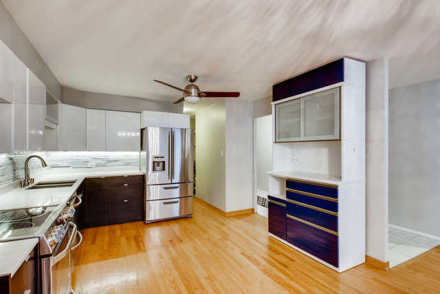 6147 North Sheridan Road, Unit 16A Chicago, IL 60660 - Photo 10 of 30 a kitchen with a refrigerator and a sink