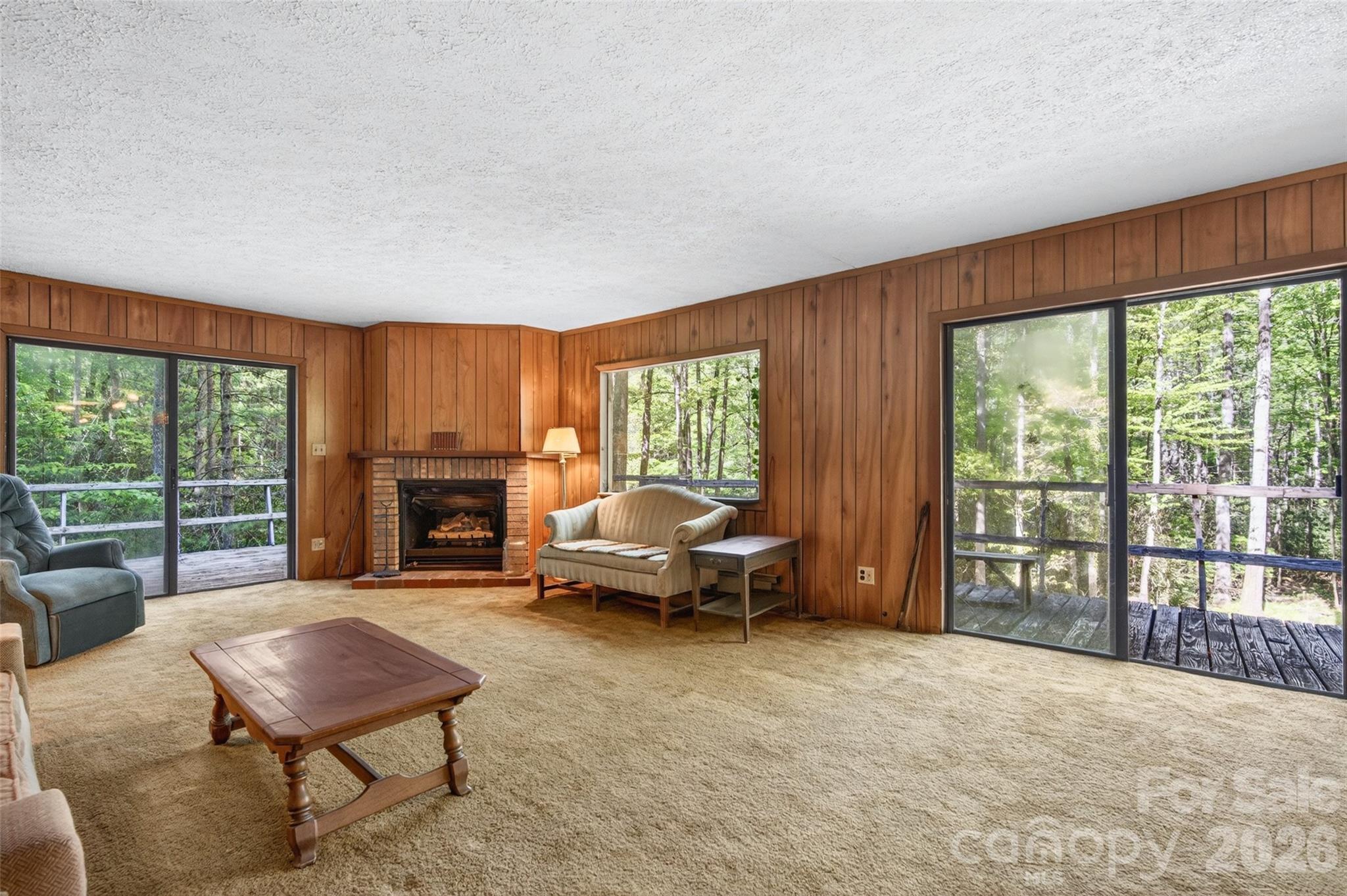 451 Signal Tree Road Deep Gap, NC 28618 - Photo 17 of 26 a living room with furniture and a fireplace