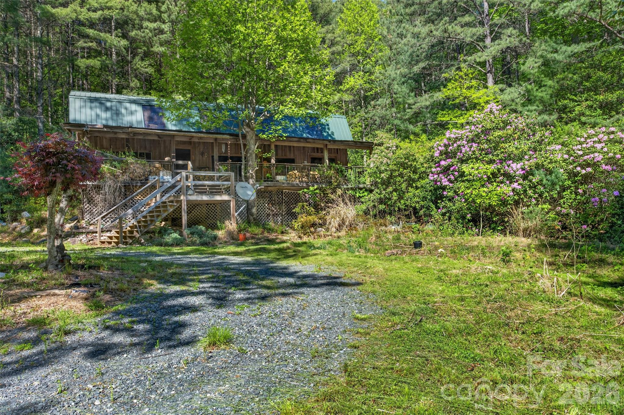 451 Signal Tree Road Deep Gap, NC 28618 - Photo 10 of 26 a front view of a house with a yard