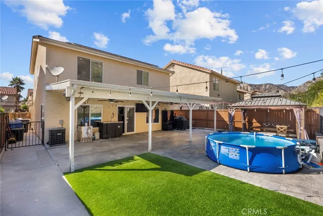 a view of a backyard with sitting area