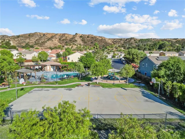 an aerial view of a house with a yard and lake view