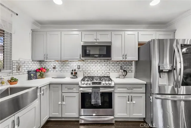 a kitchen with a stove microwave and refrigerator