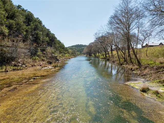 a view of a yard with trees