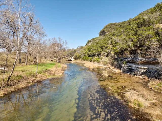 a view of a lake with a big yard