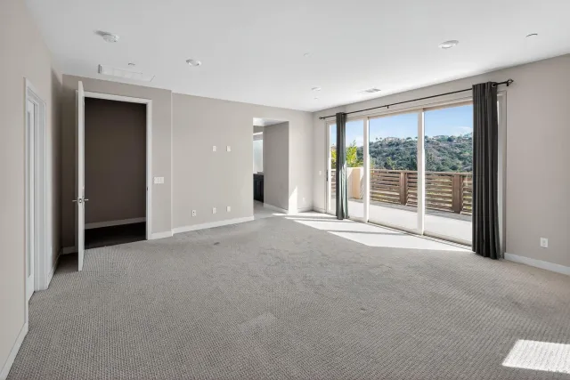 a view of a room with large windows