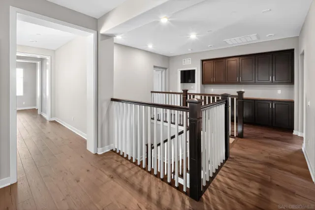 a view of a hallway with a kitchen