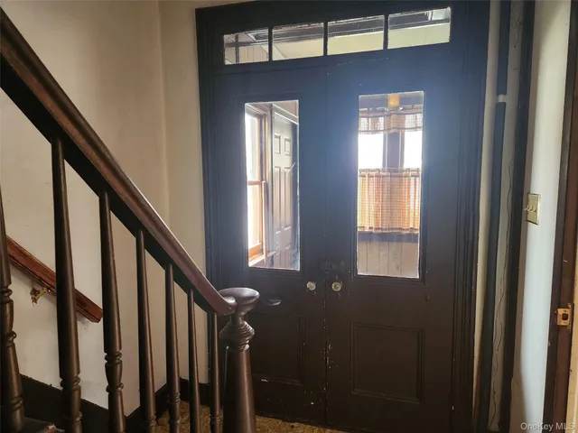 a view of an entryway with a staircase