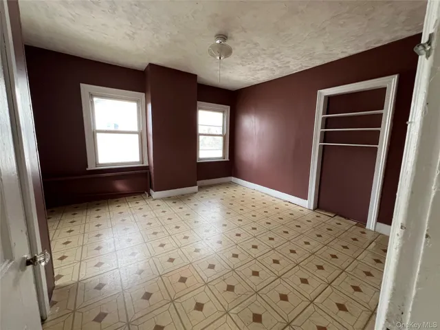 a bedroom with windows