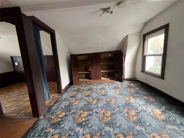 a view of empty room with front door