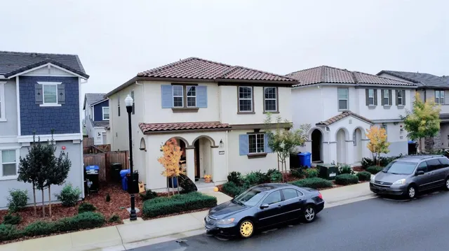 a car parked in front of a house