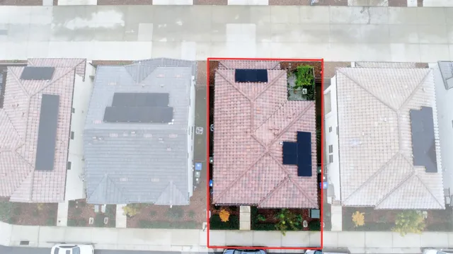 a front view of a building with a yard