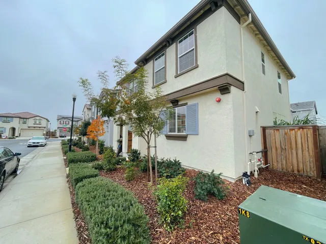 a view of a front of a house with a yard