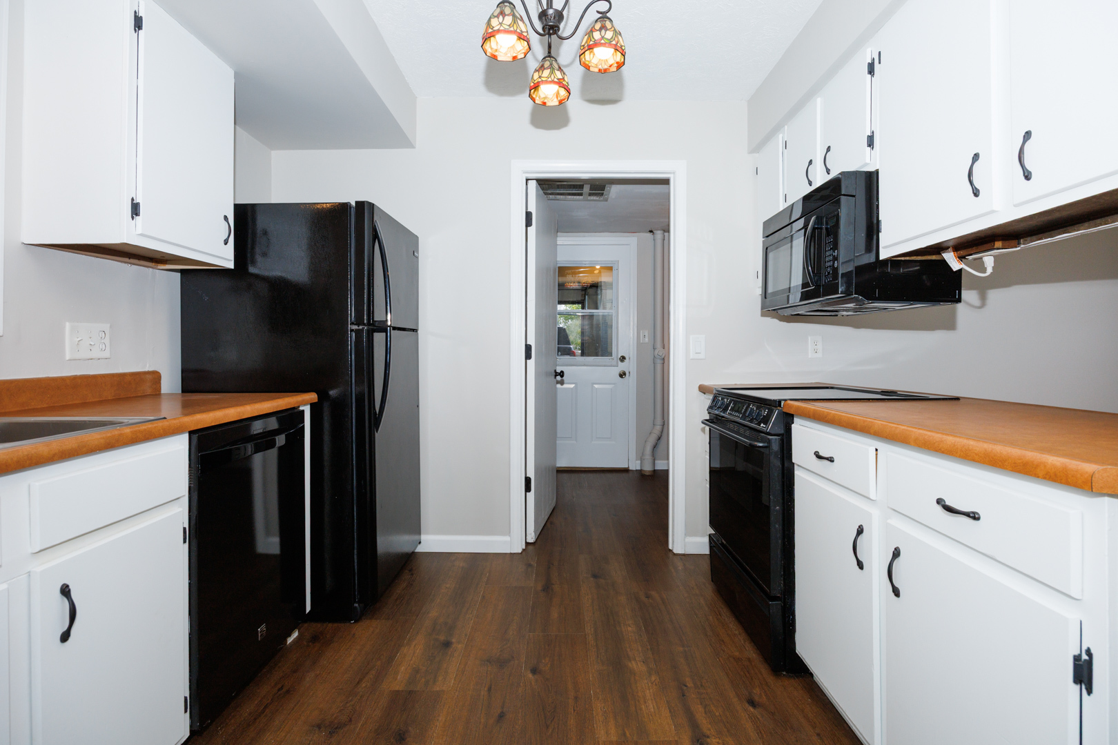 107 North Orr Drive, Unit F Normal, IL 61761 - Photo 12 of 30 a kitchen with stainless steel appliances a refrigerator microwave and sink