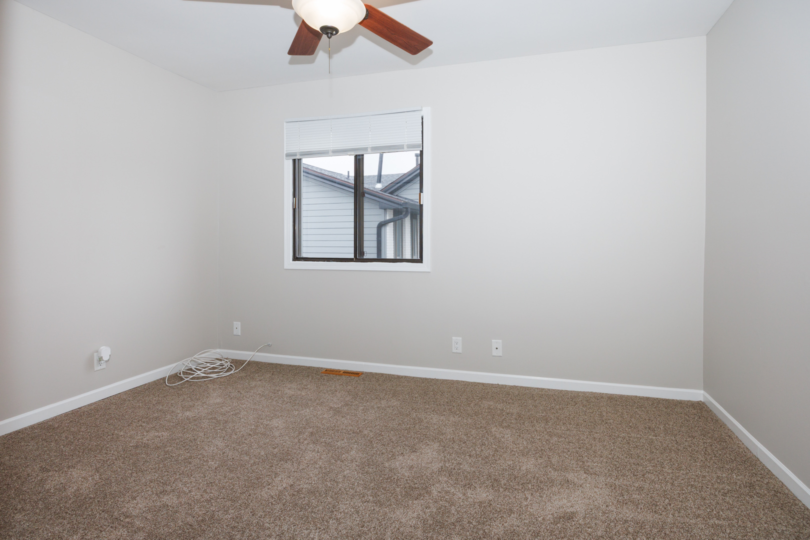 107 North Orr Drive, Unit F Normal, IL 61761 - Photo 17 of 30 an empty room with windows
