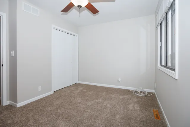 an empty room with a empty space and a window