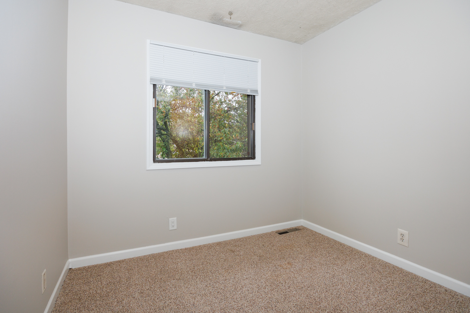 107 North Orr Drive, Unit F Normal, IL 61761 - Photo 23 of 30 an empty room with a window