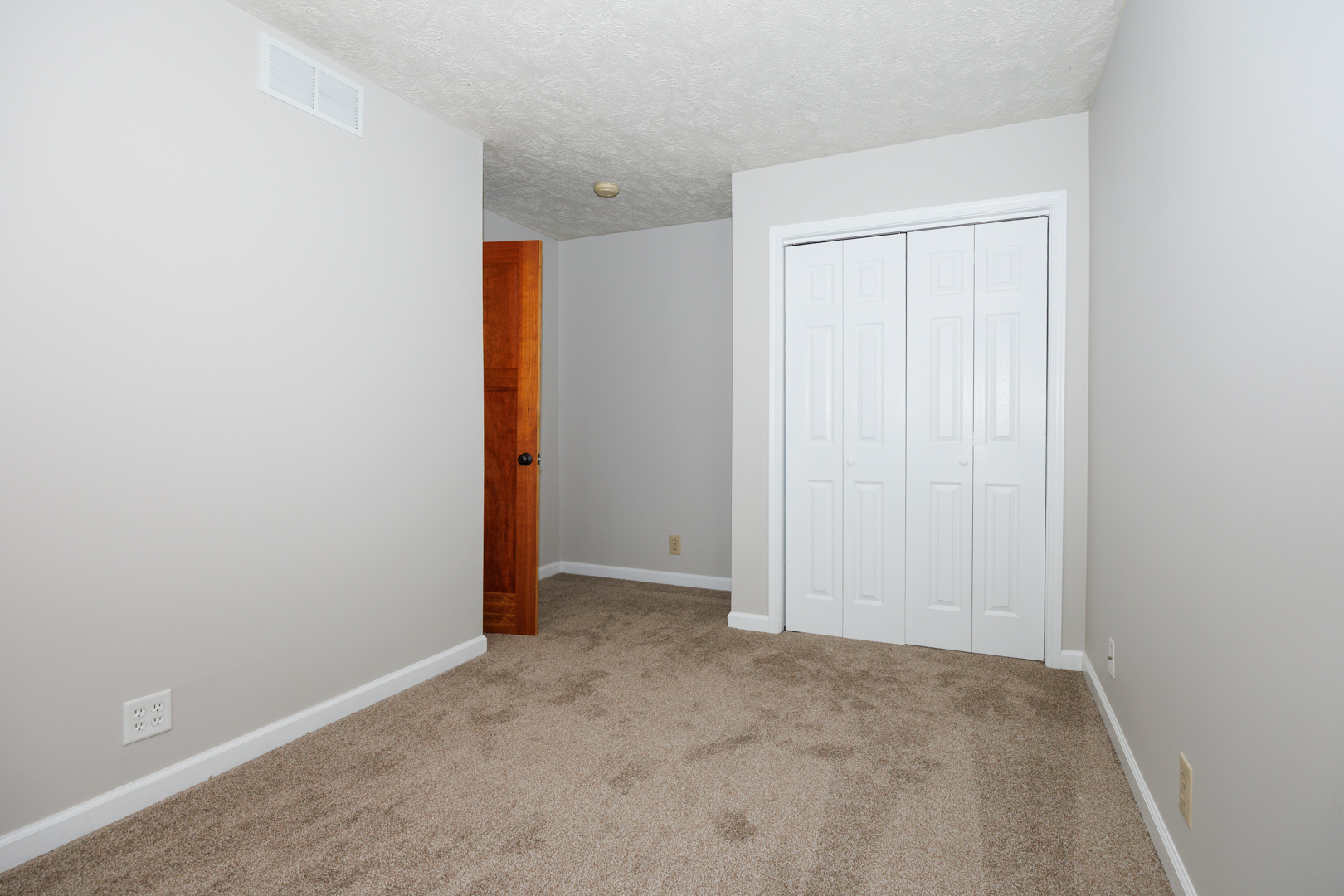107 North Orr Drive, Unit F Normal, IL 61761 - Photo 27 of 30 an empty room with an entryway