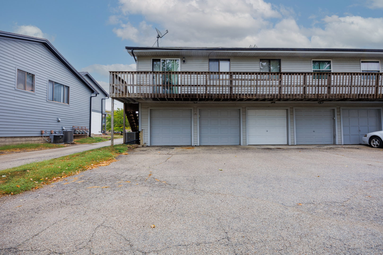 107 North Orr Drive, Unit F Normal, IL 61761 - Photo 28 of 30 a view of a house with a garage and a yard