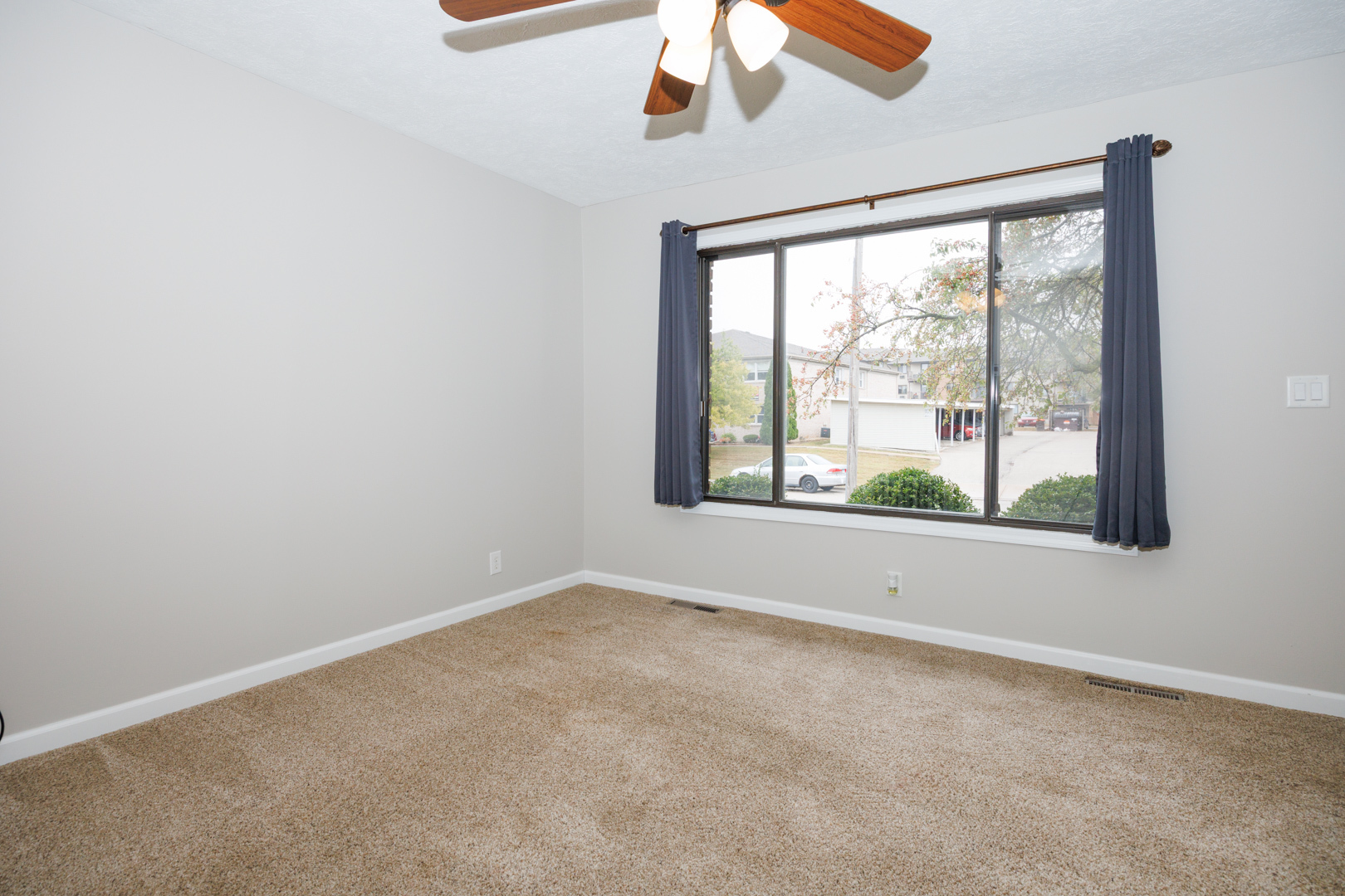 107 North Orr Drive, Unit F Normal, IL 61761 - Photo 5 of 30 an empty room with a window