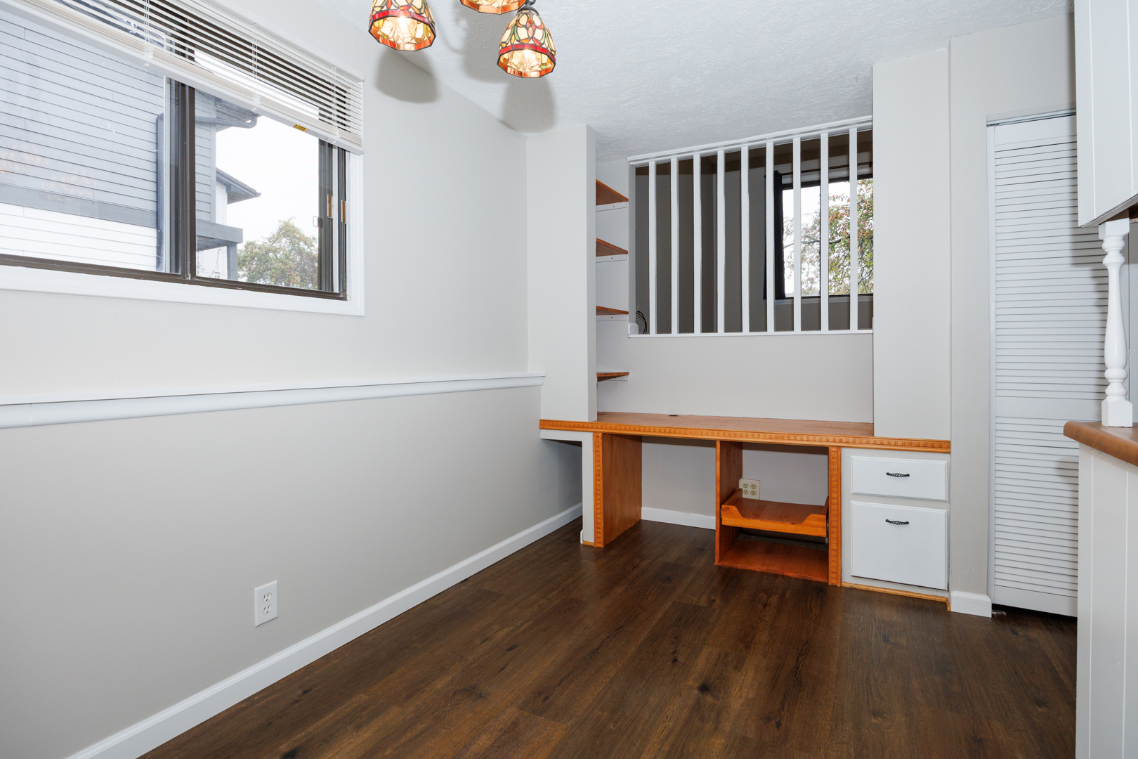 107 North Orr Drive, Unit F Normal, IL 61761 - Photo 10 of 30 a view of an empty room with wooden floor and a window