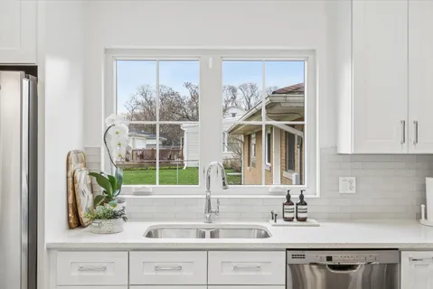 a kitchen with a sink and a window