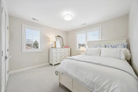 a bedroom with a bed and a closet