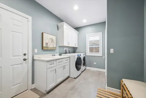 a bathroom with a sink toilet and window