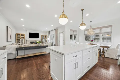 a large white kitchen with lots of counter space