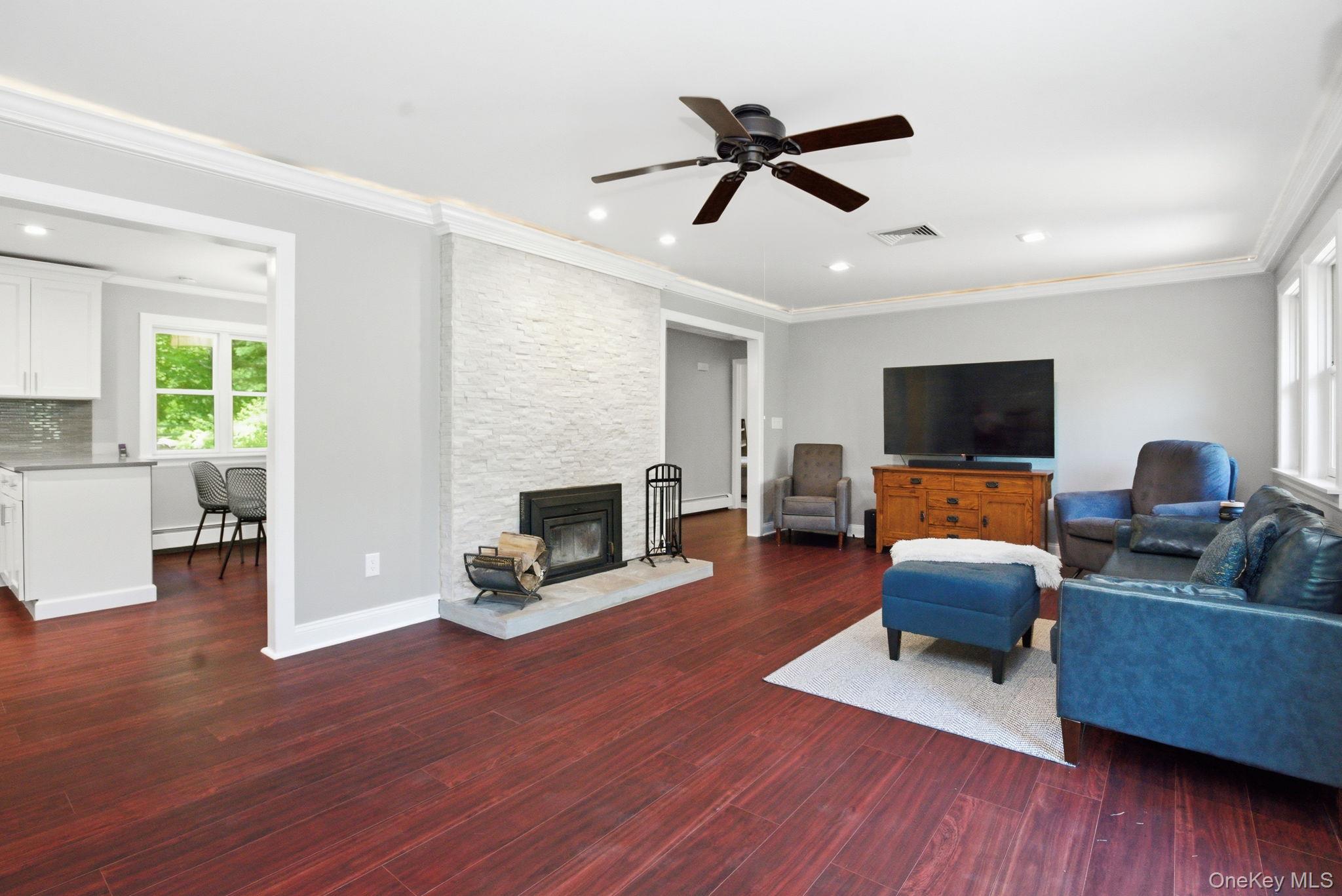 35 Deans Bridge Road Somers, NY 10589 - Photo 12 of 49 Open layout connects the living room dining room, and kitchen.