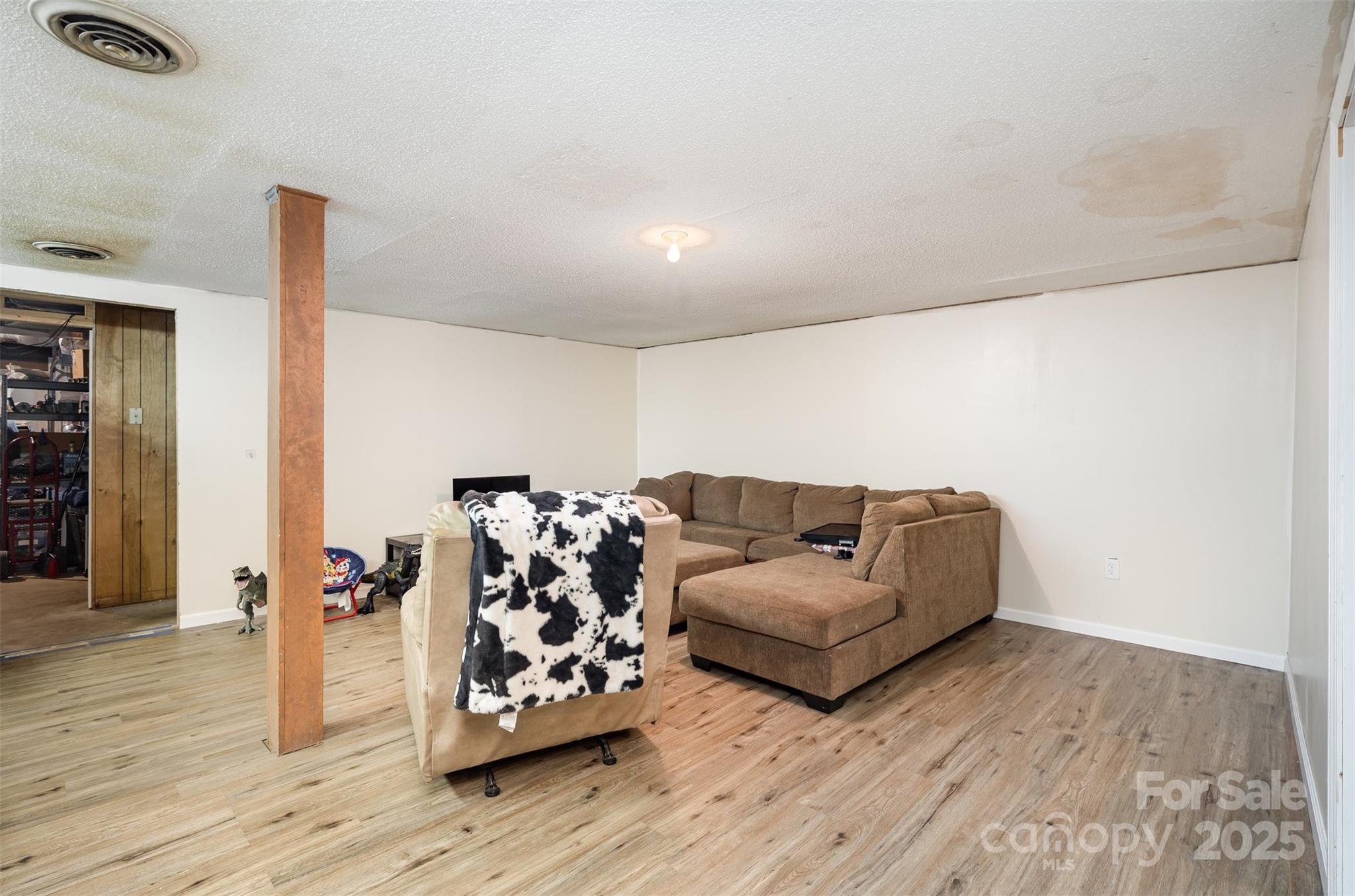 5609 Grace Chapel Road Hickory, NC 28601 - Photo 21 of 29 a living room with furniture and wooden floor