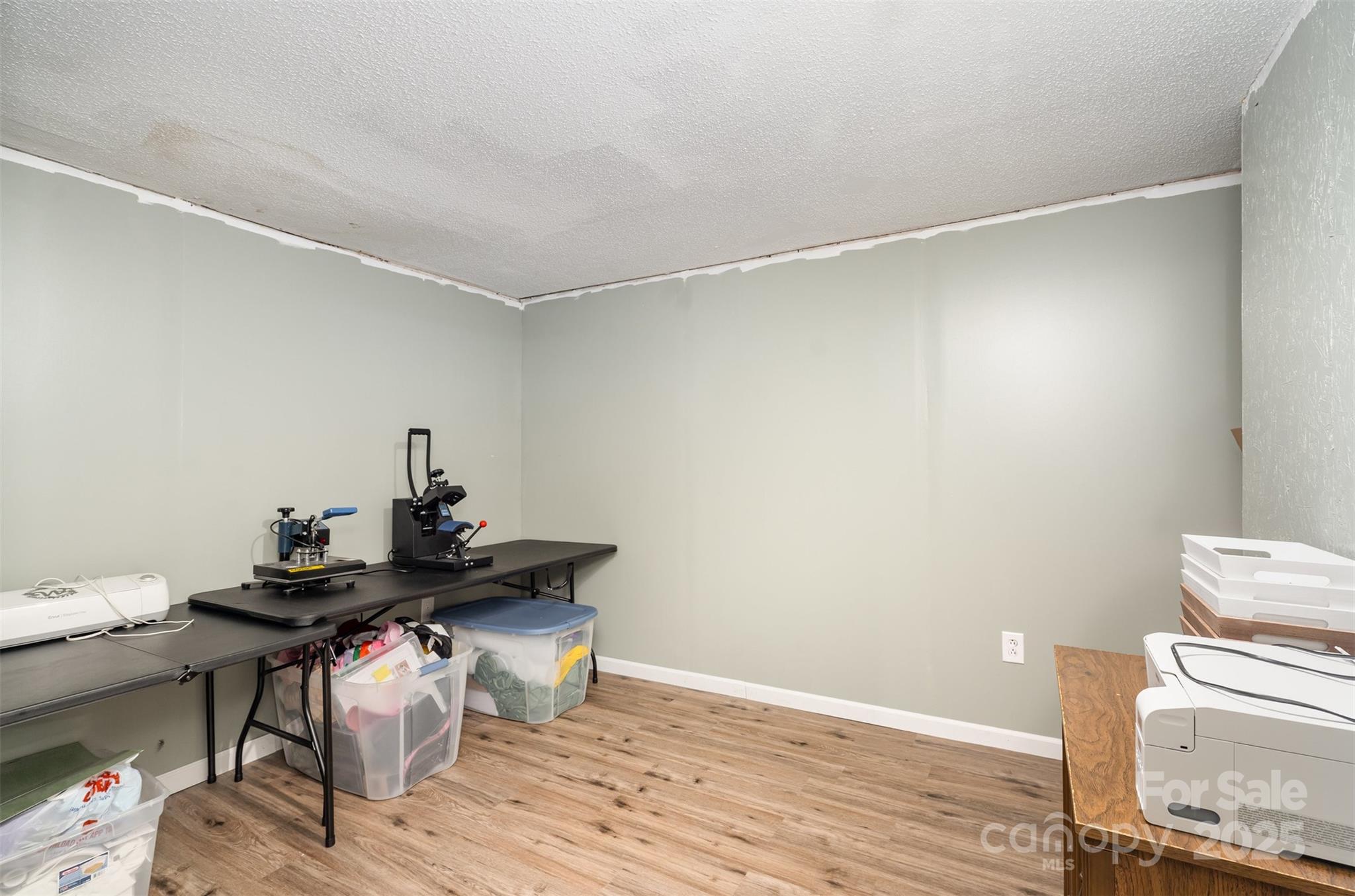 5609 Grace Chapel Road Hickory, NC 28601 - Photo 22 of 29 a view of a workspace with furniture and wooden floor