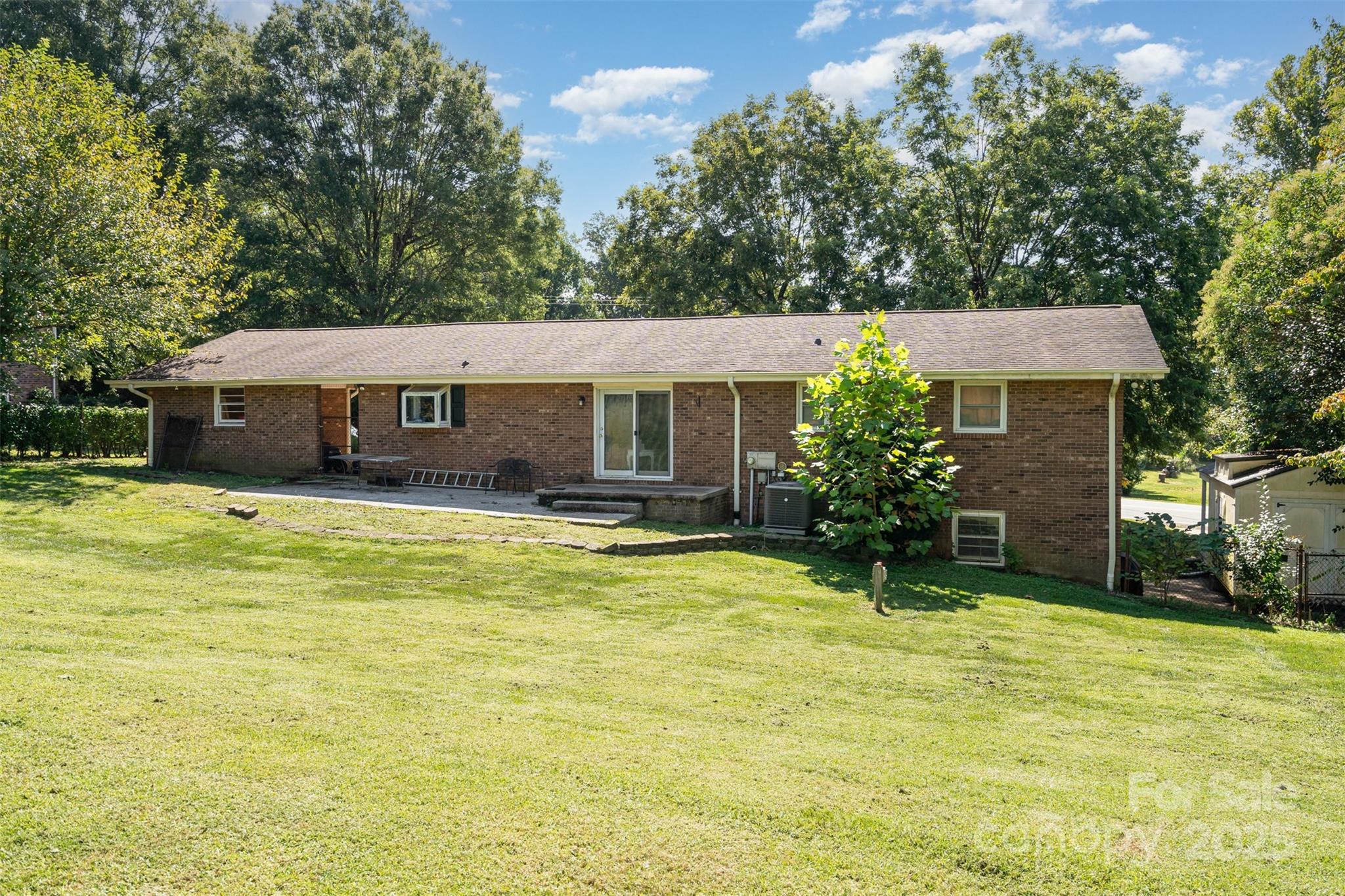 5609 Grace Chapel Road Hickory, NC 28601 - Photo 25 of 29 a view of a house with a swimming pool