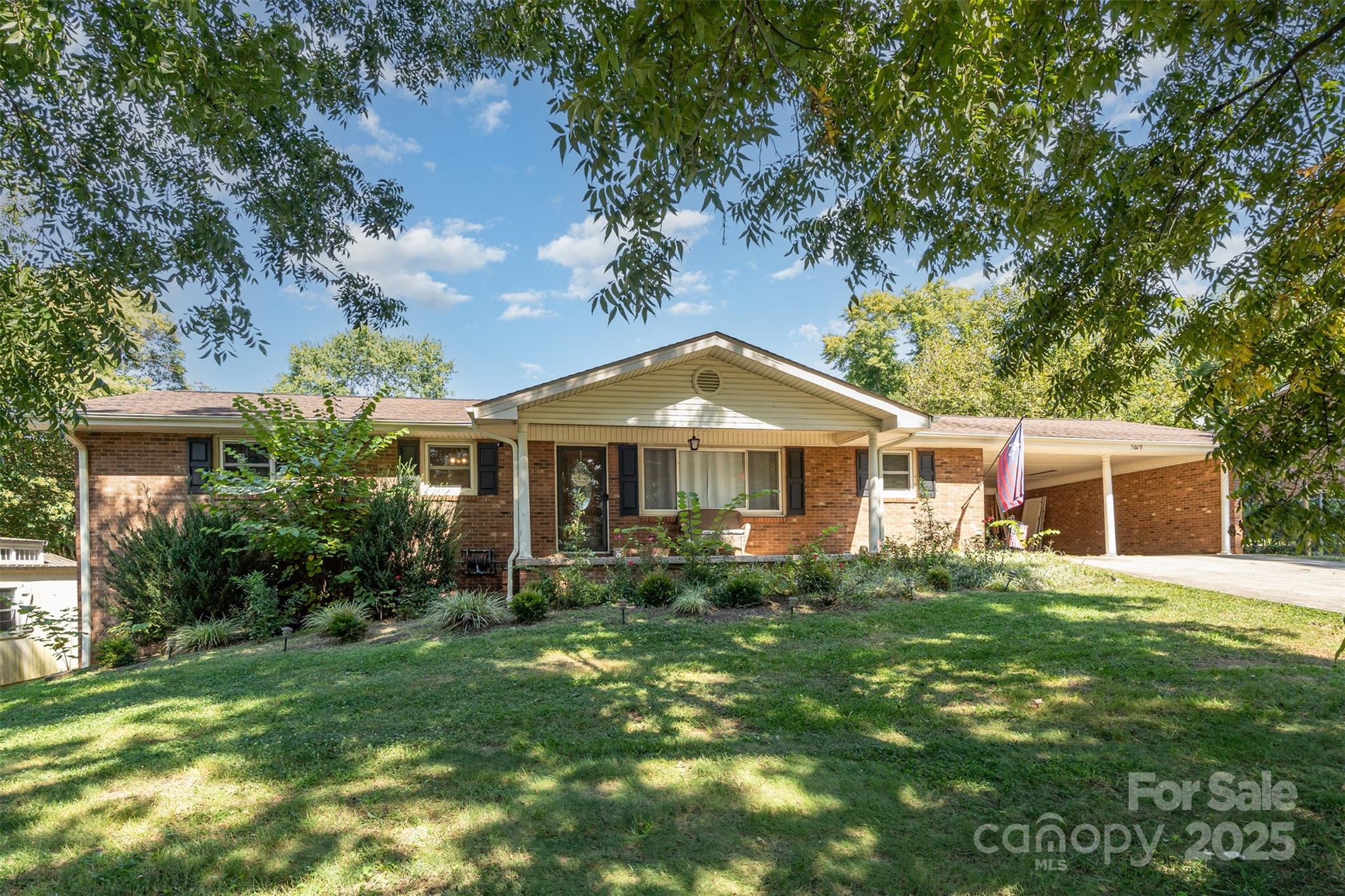 5609 Grace Chapel Road Hickory, NC 28601 - Photo 4 of 29 a front view of a house with a garden