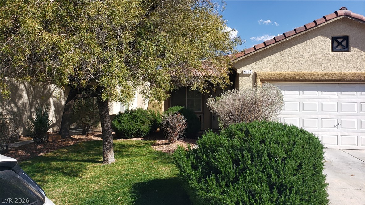 9112 Manalang Road Las Vegas, NV 89123 - Photo 2 of 50 A well-maintained facade with mature trees and verdant shrubs offers inviting curb appeal.