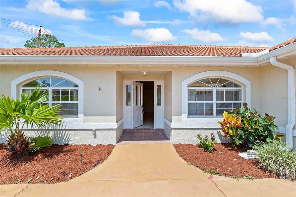 113 Pritchard Drive Palm Coast, FL 32164 - Photo 1 of 1 a front view of a house with garden