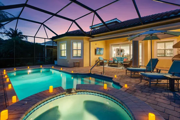 a swimming pool with outdoor seating yard and outdoor seating