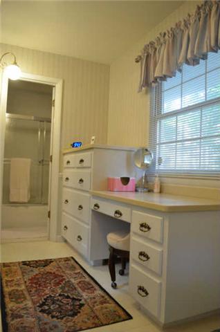 446 Belmont Road Manchester, TN 37355 - Photo 11 of 20 The dressing area is a wonderful space! It provides a nice built-in vanity & dresser, & offers tile flooring.