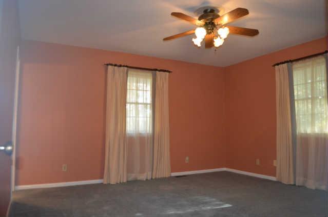 446 Belmont Road Manchester, TN 37355 - Photo 12 of 20 This large Guest Bedroom was once the original Master Suite! It offers plenty of light, ceiling fan, 2 oversized closets, AND a private Bath with combo tub/shower!