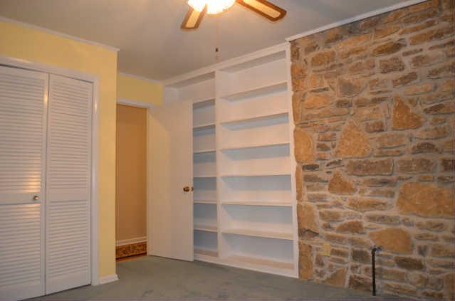 446 Belmont Road Manchester, TN 37355 - Photo 13 of 20 The 3rd Guest Bedroom is very spacious but cozy! It offers a great built-in shelving area, ceiling fan, & a nice view of the backyard.